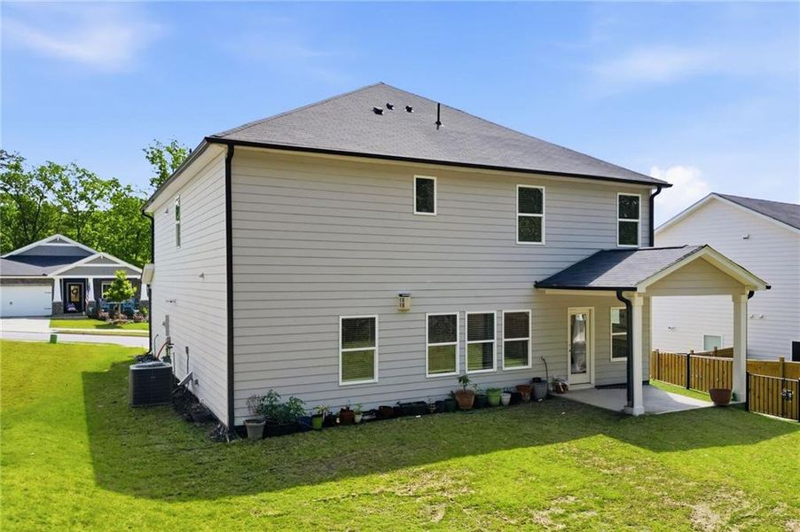 Exterior details and patio area of a home in Vistas at Towne Mill, Canton (Image 28).