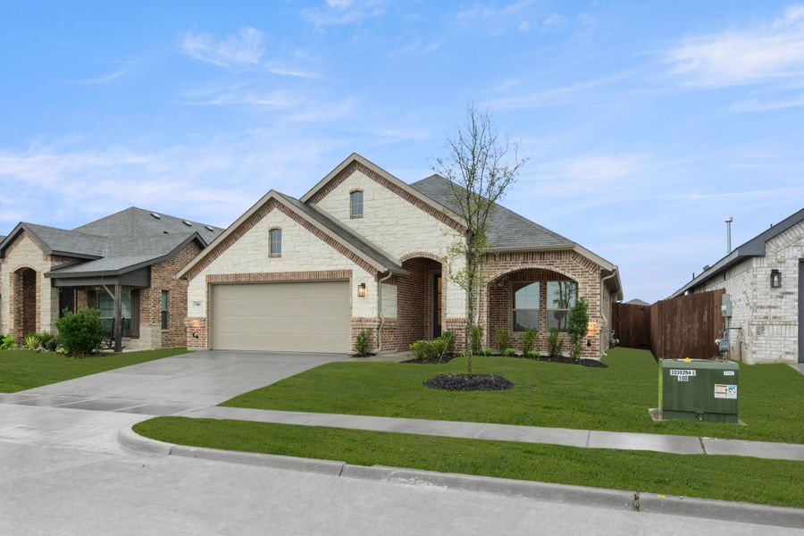 Front exterior of a new home in Chisholm Hills, Cleburne, TX, highlighting curb appeal (Image 2). Front exterior of a new home in Chisholm Hills, Cleburne, TX, highlighting curb appeal (Image 2).