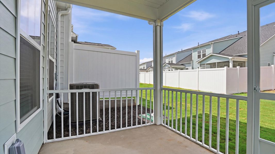 Exceptional outdoor living begins with a covered screened-in porch in this thoughtfully designed home in Anderson, SC
