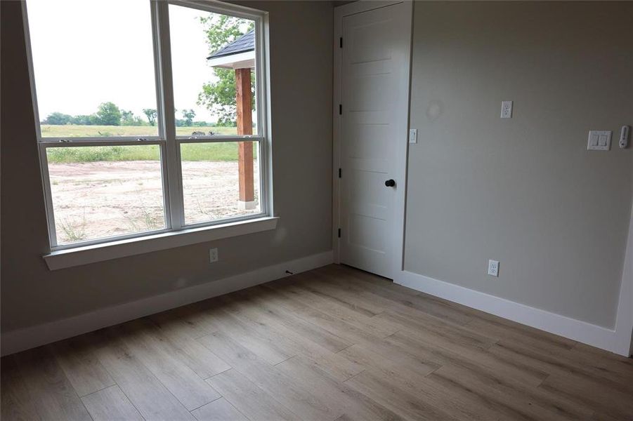 Unfurnished room featuring light hardwood / wood-style flooring