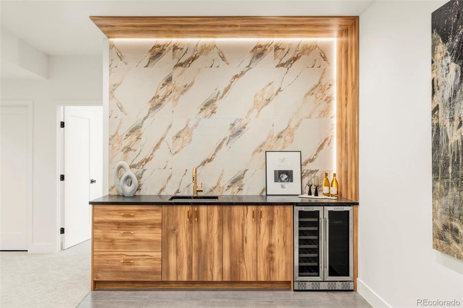 Striking backlit basement wet bar Striking backlit basement wet bar