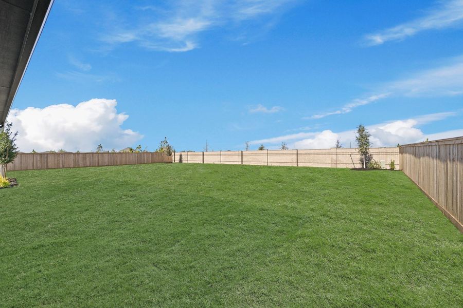 Exterior details and patio area of a home in Bridgeland, Cypress (Image 28).