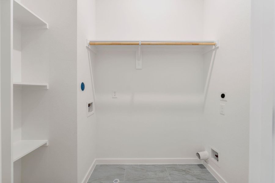 Spacious laundry room completes the second floor.