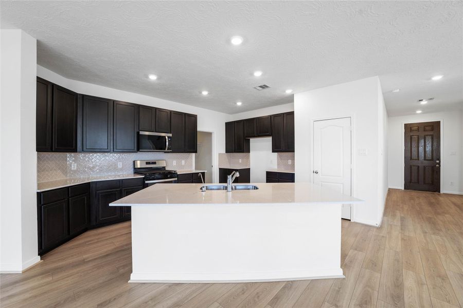 This kitchen has it all—ample storage, generous counter space, and a layout that truly makes it the heart of the home. This kitchen has it all—ample storage, generous counter space, and a layout that truly makes it the heart of the home.