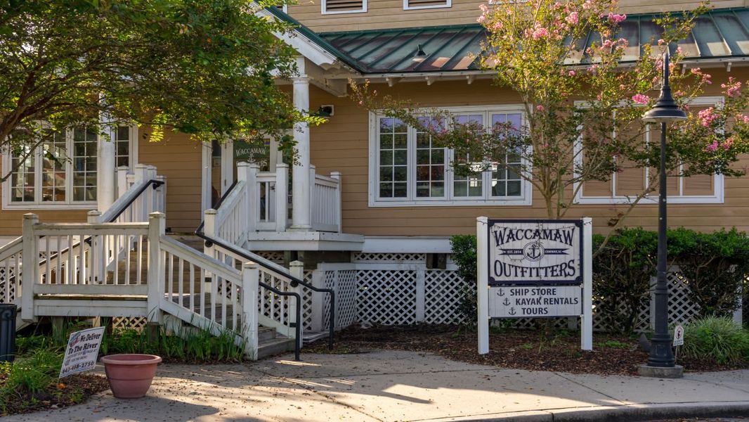Front exterior of a new home in Coastal Farms, Conway, SC, highlighting curb appeal (Image 2). Front exterior of a new home in Coastal Farms, Conway, SC, highlighting curb appeal (Image 2).