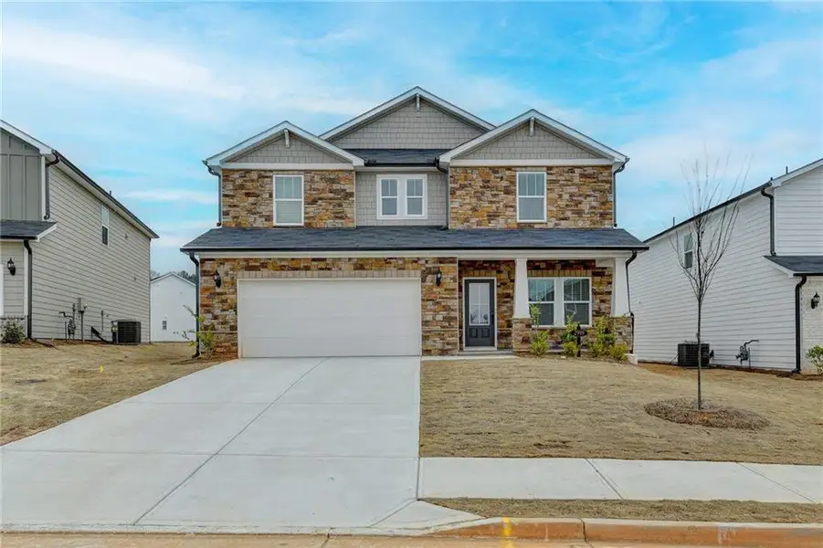 Front exterior of a new home in , Braselton, GA, highlighting curb appeal (Image 1). Front exterior of a new home in , Braselton, GA, highlighting curb appeal (Image 1).