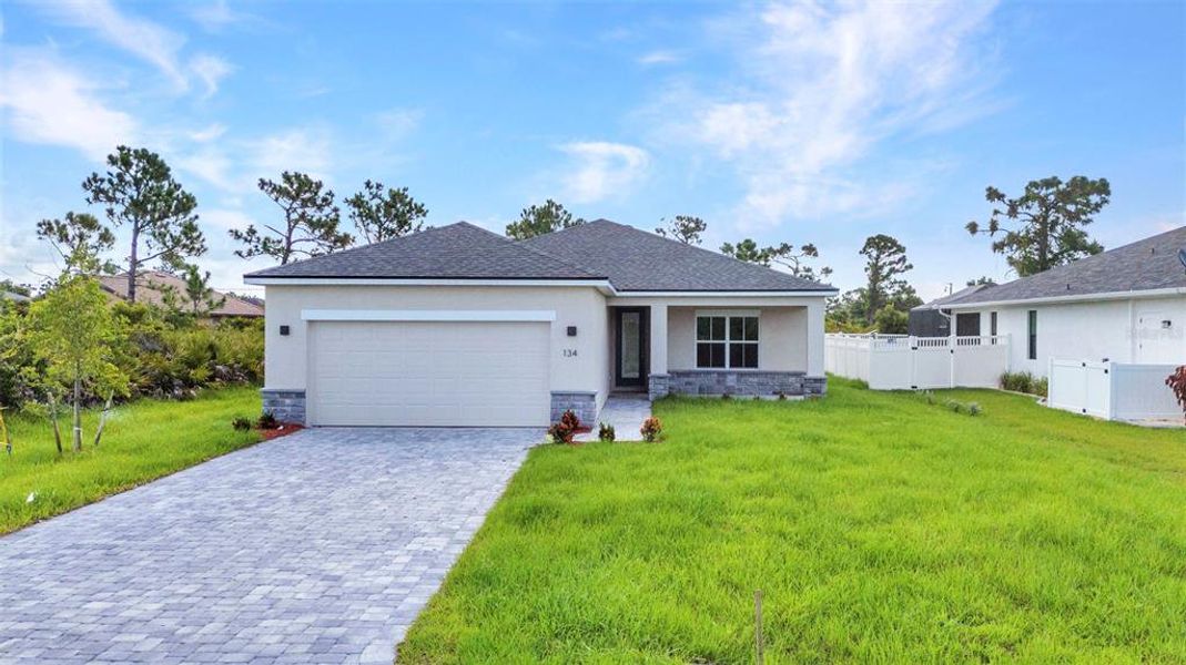 Front exterior of a new home in , Rotonda West, FL, highlighting curb appeal (Image 28). Front exterior of a new home in , Rotonda West, FL, highlighting curb appeal (Image 28).