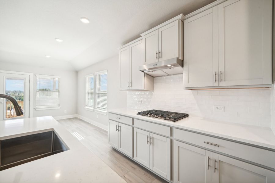 Kitchen in the Preston floorplan at a Meritage Homes community.