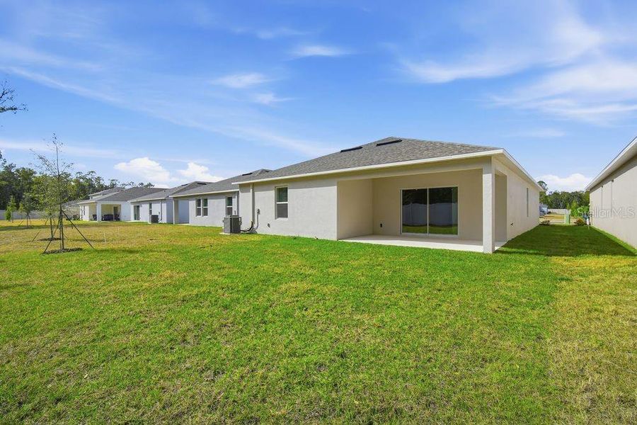 Exterior details and patio area of a home in Palm Wind, Hudson (Image 4). Exterior details and patio area of a home in Palm Wind, Hudson (Image 4).