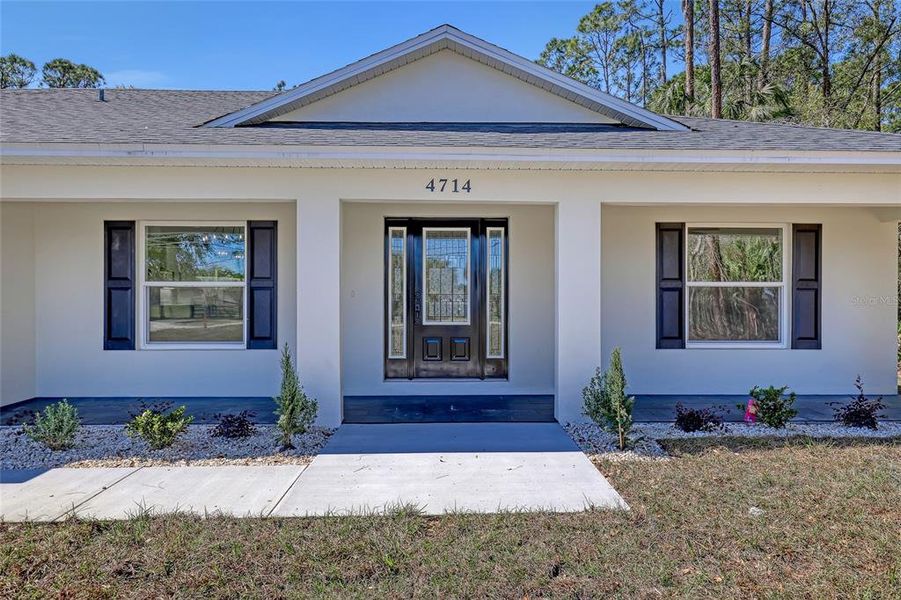 Front exterior of a new home in , Mims, FL, highlighting curb appeal (Image 29).