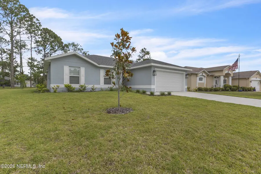 Front exterior of a new home in , Palm Coast, FL, highlighting curb appeal (Image 24).
