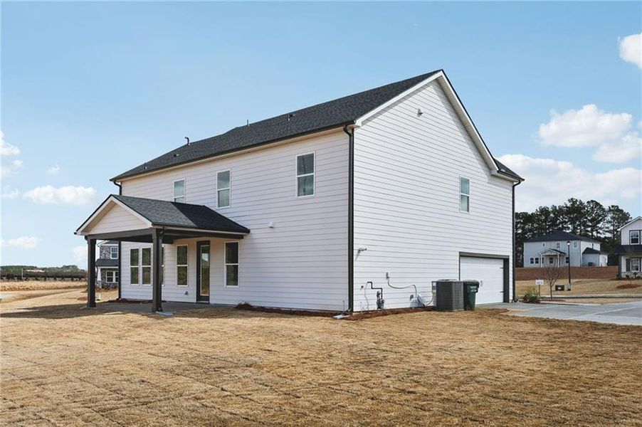 Exterior details and patio area of a home in River Pointe, Monroe (Image 4).
