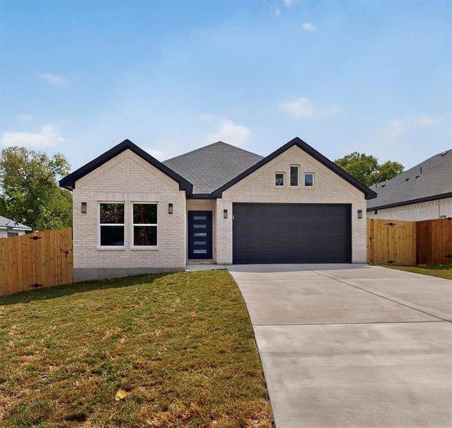 View of front of house with driveway, brick siding, and a garage View of front of house with driveway, brick siding, and a garage