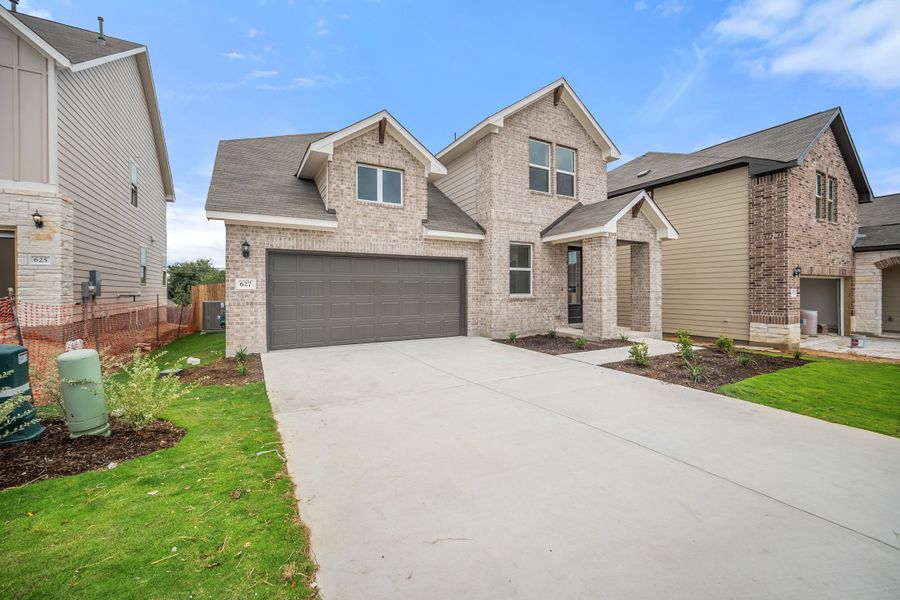 Representative exterior photo of a completed home built from the Sierra by Ashton Woods in Berry Creek Highlands, Georgetown, TX (Image 23).