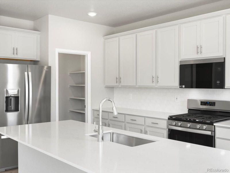 Furnished interior view inside a new home in Poudre Heights: The Alpine Collection, Windsor (Image 12).