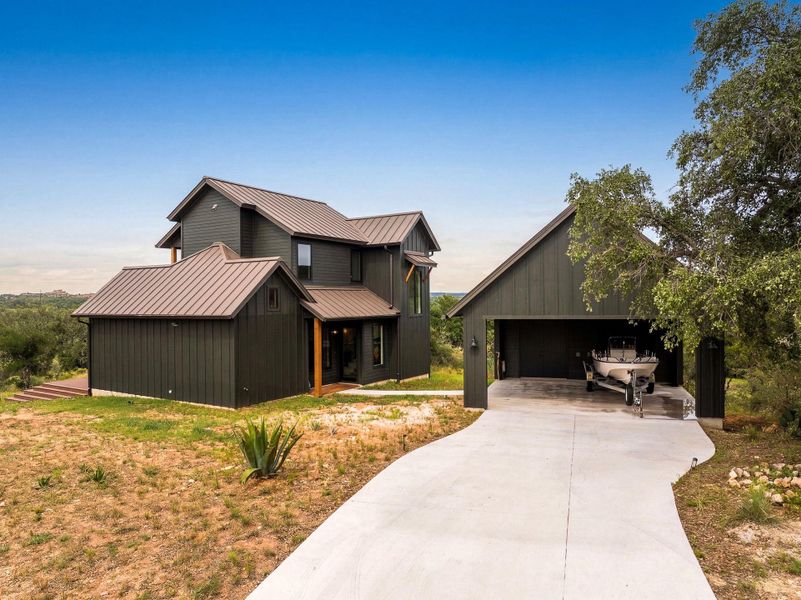 Bold vertical siding and a durable metal roof define this striking modern exterior design.
