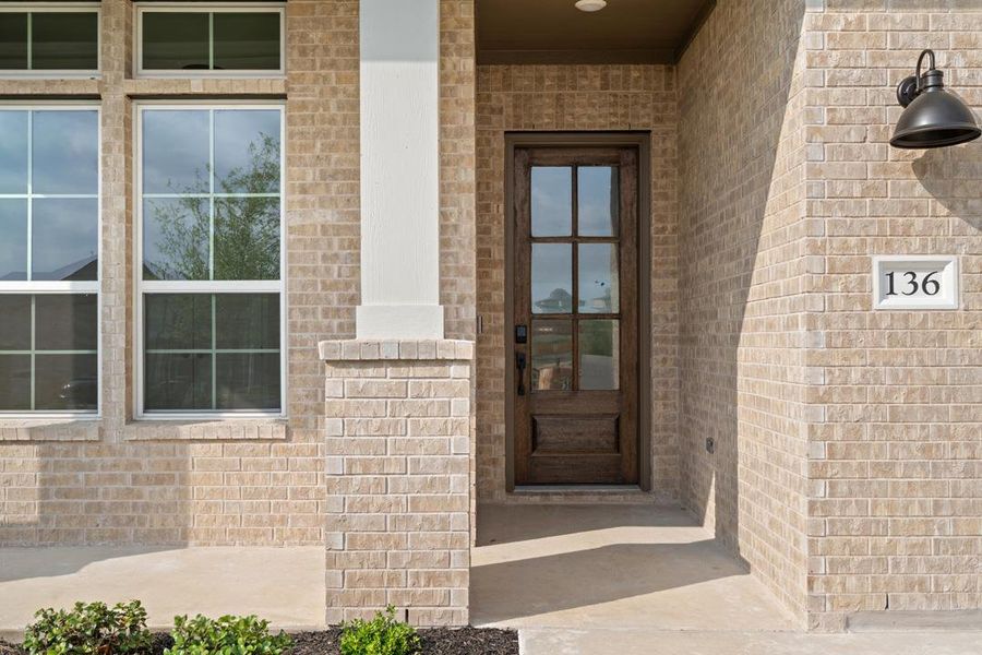 Front exterior of a new home in Park Collection at Lariat, Liberty Hill, TX, highlighting curb appeal (Image 23). Front exterior of a new home in Park Collection at Lariat, Liberty Hill, TX, highlighting curb appeal (Image 23).