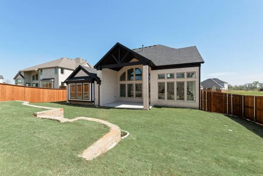 Exterior details and patio area of a home in Chatham Reserve, Providence Village (Image 3).
