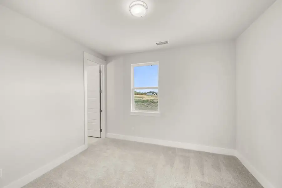 Representative unfurnished interior of a home built from the Liberty by Rockwell Homes in Wildflower Ranch, Justin (Image 32).