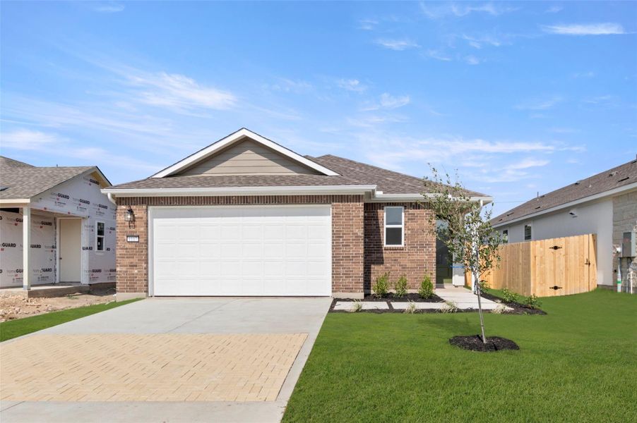 Front exterior of a new home in The Enclave at Hidden Oaks, Georgetown, TX, highlighting curb appeal (Image 2). Front exterior of a new home in The Enclave at Hidden Oaks, Georgetown, TX, highlighting curb appeal (Image 2).