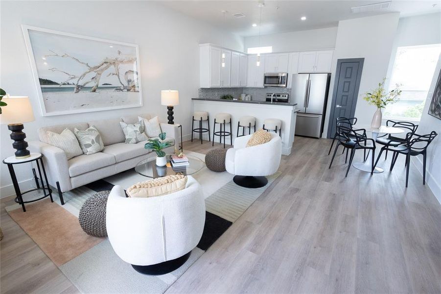 Living room with light wood-type flooring