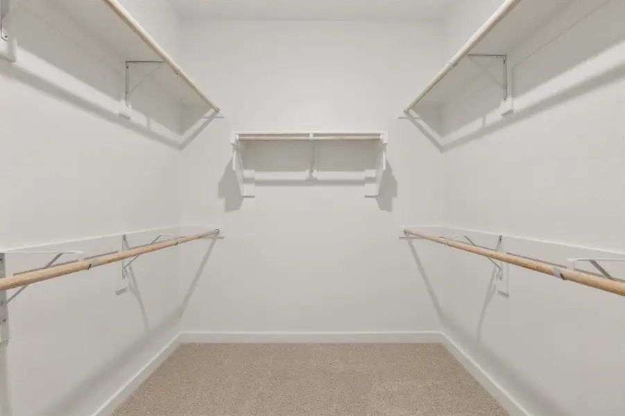 Primary Closet in the Masters home plan by Trophy Signature Homes – REPRESENTATIVE PHOTO