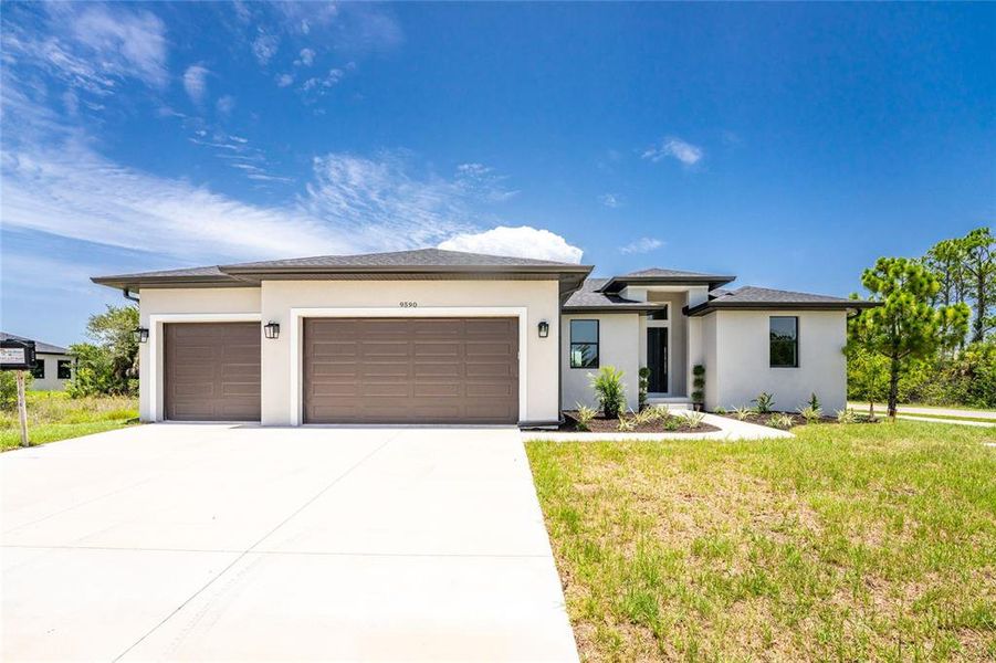 Front exterior of a new home in , Port Charlotte, FL, highlighting curb appeal (Image 1). Front exterior of a new home in , Port Charlotte, FL, highlighting curb appeal (Image 1).