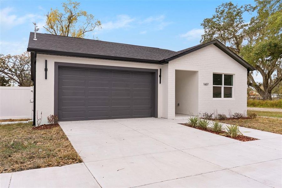 Front exterior of a new home in , Tampa, FL, highlighting curb appeal (Image 1). Front exterior of a new home in , Tampa, FL, highlighting curb appeal (Image 1).