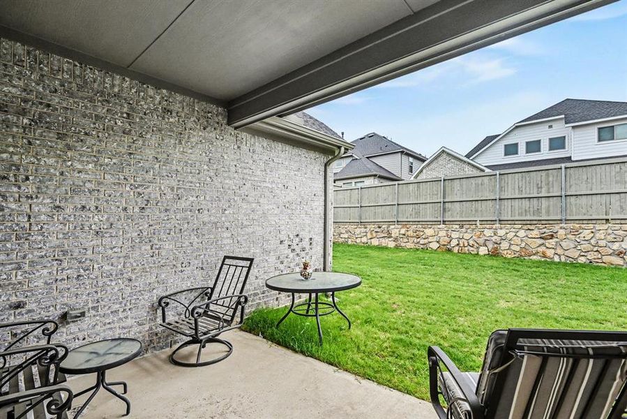 Exterior details and patio area of a home in Pecan Square, Justin (Image 3).