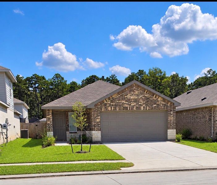 Front exterior of a new home in Breckenridge Forest, Spring, TX, highlighting curb appeal (Image 17).