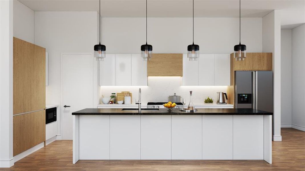 Kitchen featuring white cabinets, hanging light fixtures, and modern cabinets