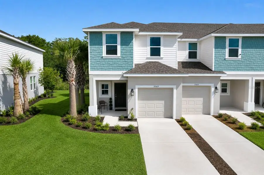 Front exterior of a new home in , Kissimmee, FL, highlighting curb appeal (Image 21).