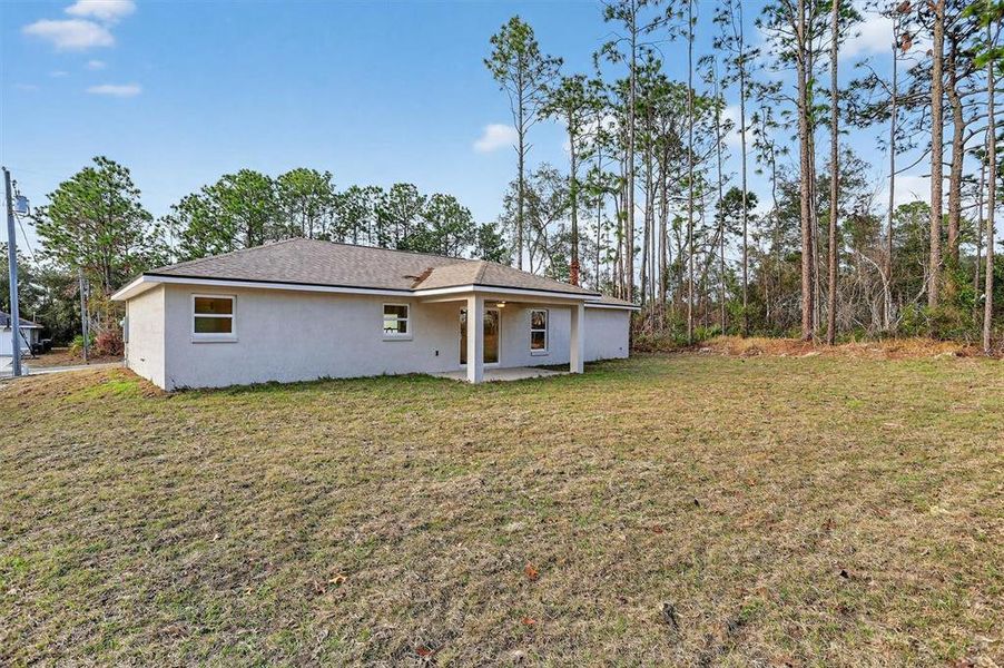 Exterior details and patio area of a home in , Citrus Springs (Image 23).