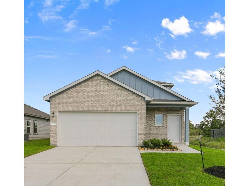 Front exterior of a new home in The Villages at WestPointe, Dayton, TX, highlighting curb appeal (Image 1).