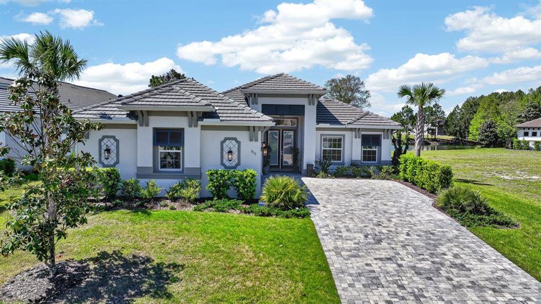 Front exterior of a new home in , Palm Coast, FL, highlighting curb appeal (Image 26).