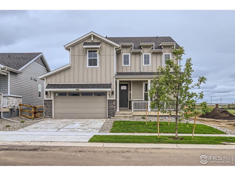 Front exterior of a new home in Barefoot Lakes, Longmont, CO, highlighting curb appeal (Image 2). Front exterior of a new home in Barefoot Lakes, Longmont, CO, highlighting curb appeal (Image 2).