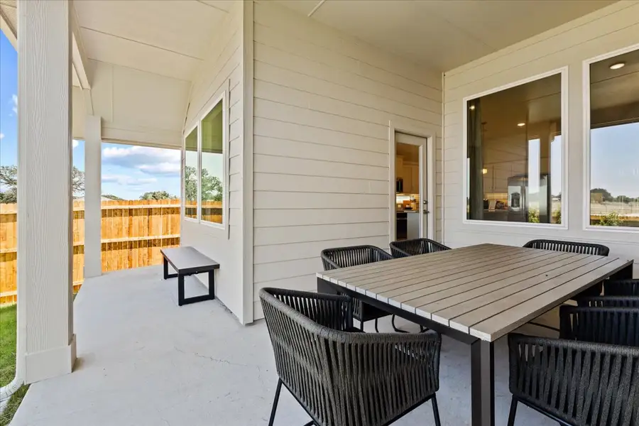 Exterior details and patio area of a home in Keeneland, Aubrey (Image 3).