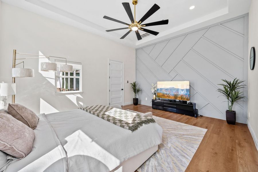 The bedroom has an architectural accent wall that adds rich texture and a creative, designer touch to the room.