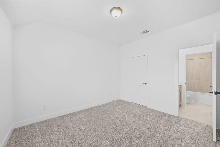Representative unfurnished interior of a home built from the Madison by Chesmar Homes in Grange, Katy (Image 35).