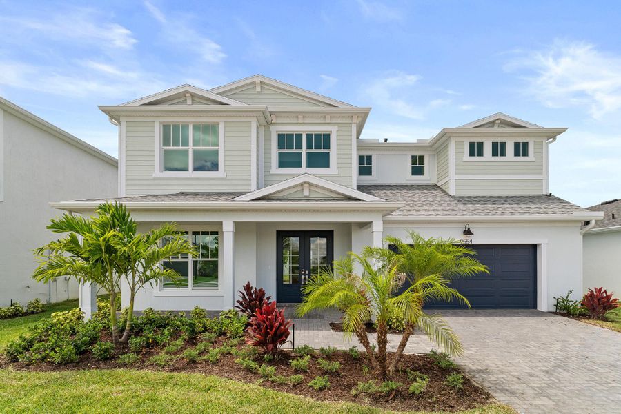 Front exterior of a new home in Tradition - Kenley, Port St. Lucie, FL, highlighting curb appeal (Image 1). Front exterior of a new home in Tradition - Kenley, Port St. Lucie, FL, highlighting curb appeal (Image 1).