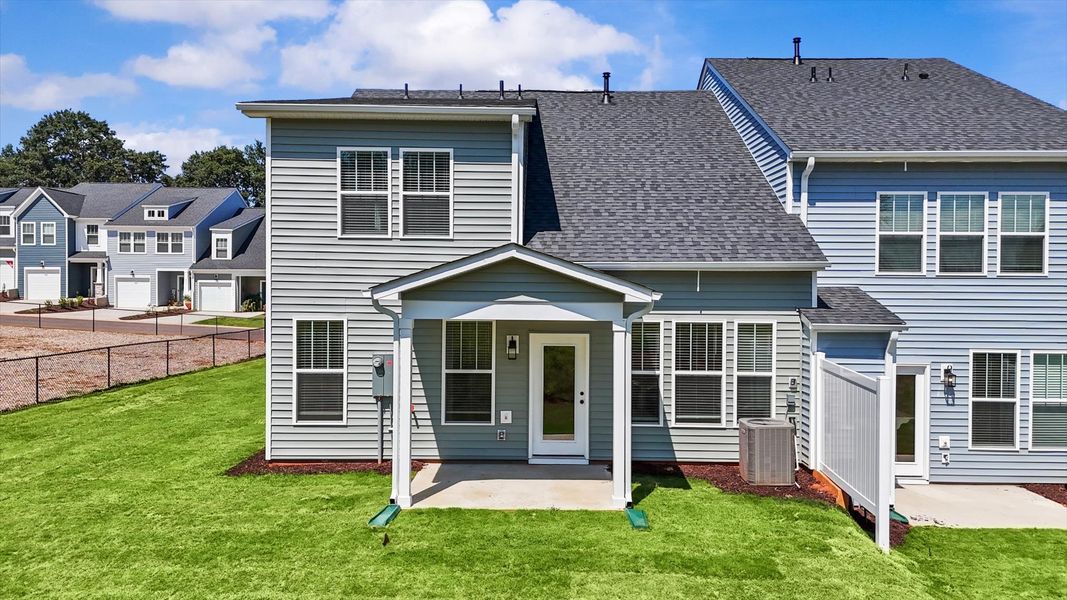 Rear covered porch offers a private, first-rate setting for outdoor enjoyment