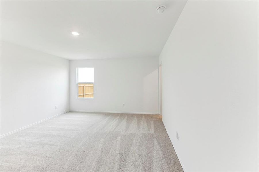 Spare room with light colored carpet