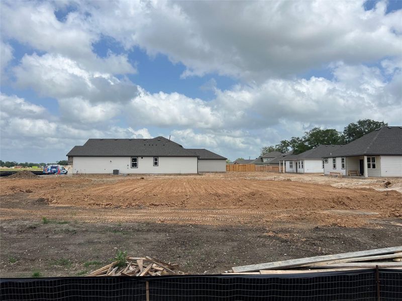 Front exterior of a new home in Valor Park 70', Bay City, TX, highlighting curb appeal (Image 2). Front exterior of a new home in Valor Park 70', Bay City, TX, highlighting curb appeal (Image 2).