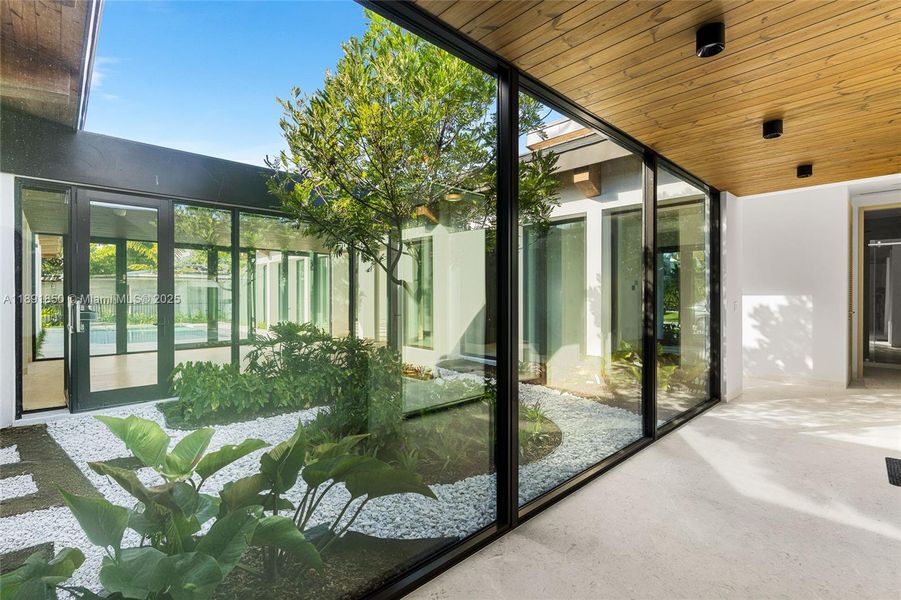 Exterior details and patio area of a home in , Coral Gables (Image 21).