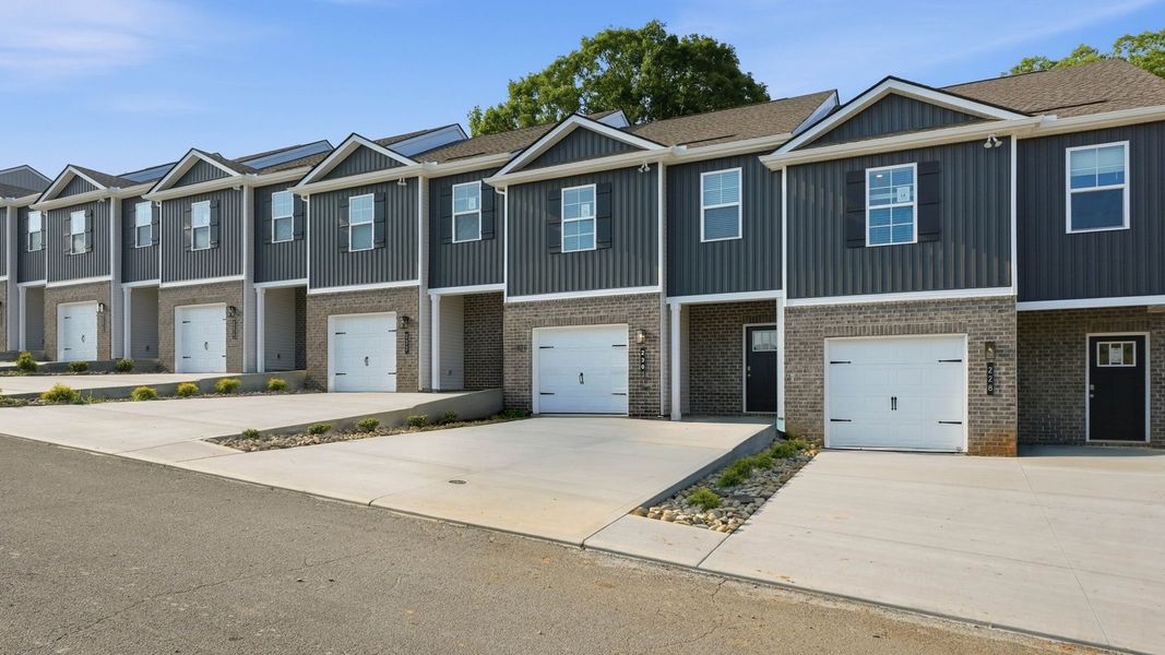 Front exterior of a new home in Macon Townhomes, Seymour, TN, highlighting curb appeal (Image 2).