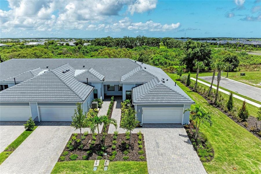 Front exterior of a new home in , Lakewood Ranch, FL, highlighting curb appeal (Image 1). Front exterior of a new home in , Lakewood Ranch, FL, highlighting curb appeal (Image 1).