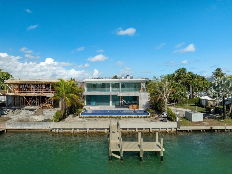 Front exterior of a new home in , Surfside, FL, highlighting curb appeal (Image 17).