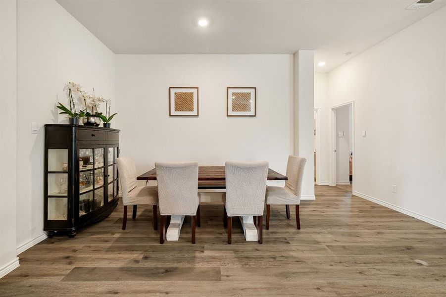 Dining area featuring wood finished floors and recessed lighting Dining area featuring wood finished floors and recessed lighting