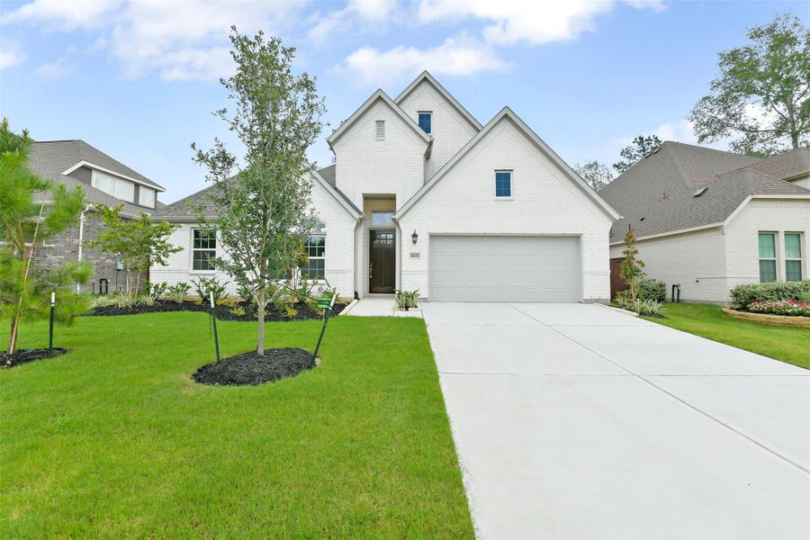 Front exterior of a new home in , Conroe, TX, highlighting curb appeal (Image 20).
