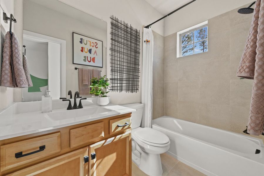 Representative furnished interior of a home built from the Chantilly 2 by Chesmar Homes in Sienna Chateau, Missouri City (Image 18).